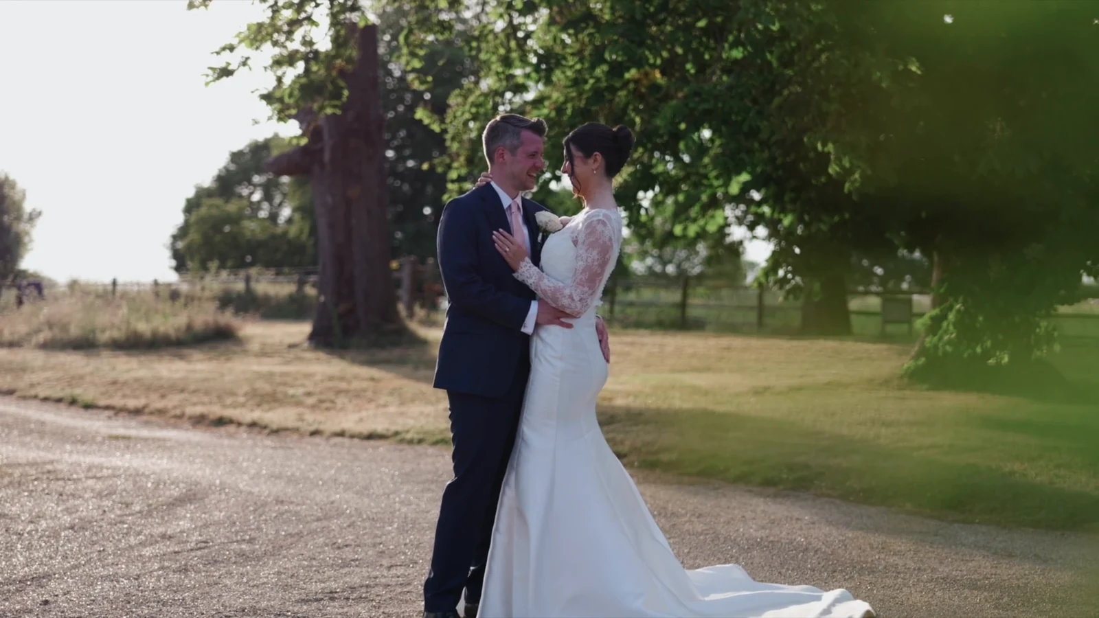 Charlotte and Patrick together in the sunlit grounds at Great Lodge