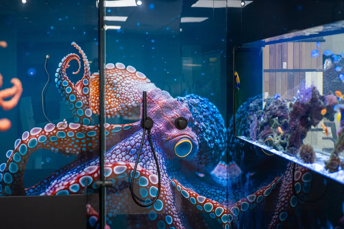 An octopus shower design beside the saltwater aquarium in the Pete Bird showroom
