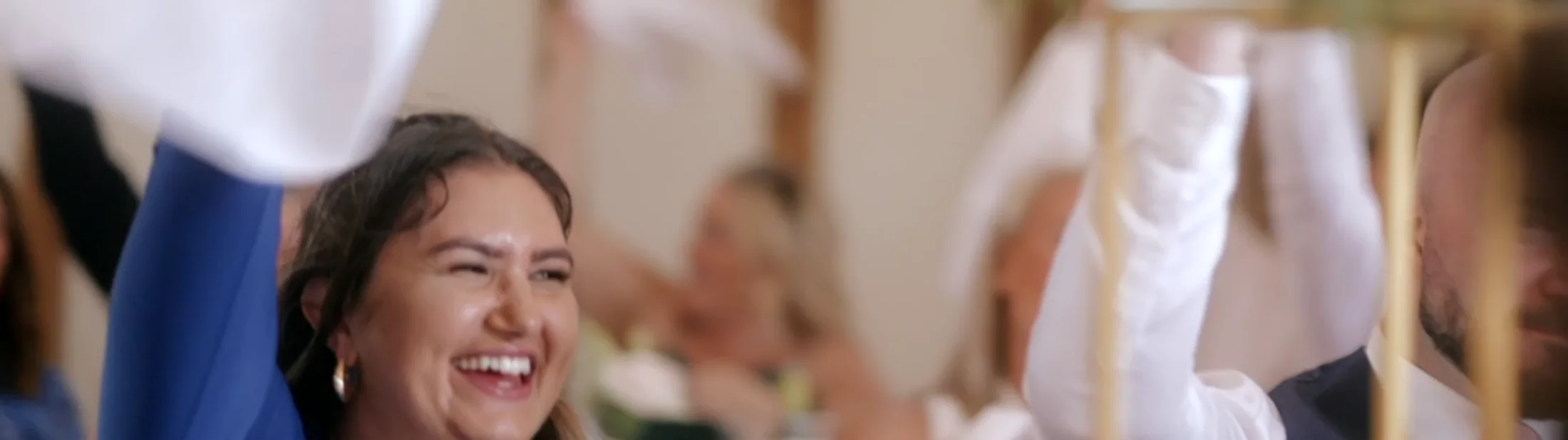 A guest celebrating during an E-Motions wedding film